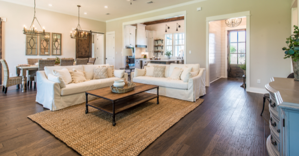 Beautiful family room with wood flooring and large rug Beautiful family room with wood flooring and large rug
