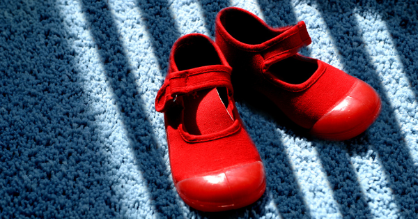 Red shoes on blue carpet Red shoes on blue carpet