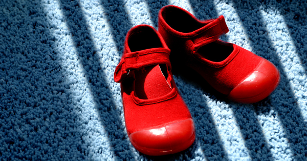 Red shoes on blue carpet