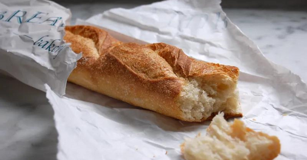 baguette in a paper wrapper baguette in a paper wrapper